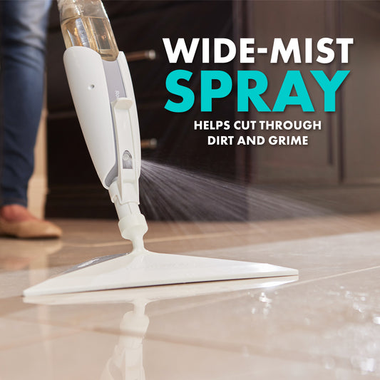 The Roommate Mop spraying cleaning solution and cleaning the floor